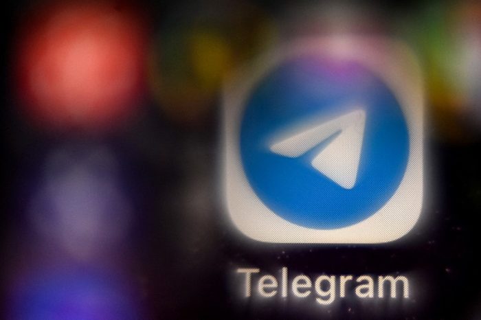 A picture taken on November 8, 2021 in Moscow shows the mobile messaging and call service Telegram logo on a smartphone screen. A Moscow court on November 8 ordered fresh fines for US tech giant Google and Russian-founded encrypted messaging service Telegram, accusing the companies of not removing illegal content. Russia has piled fines on the world's biggest tech companies in recent months, with authorities accusing them of not moderating their content properly and interfering in the country's affairs. (Photo by Kirill KUDRYAVTSEV / AFP)
